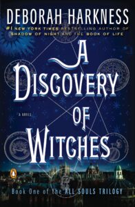  Book cover for "A Discovery of Witches" by Deborah Harkness, featuring white text and occult symbols over a deep blue night sky, with a city skyline at the bottom. Vampire romance book list